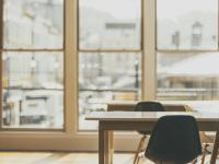 empty classroom tables with window in background