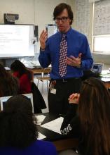 close up of teacher in front of first row of students