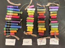 Samples of thermochromic pencils exposed to heat, ammonia vapor, and hydrogen chloride vapor. 