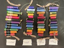 Samples of thermochromic pencils exposed to heat, ammonia vapor, and hydrogen chloride vapor. 