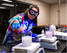 Linda Cummings pouring solution into beaker