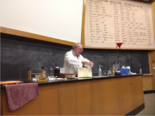 Michael Morgan behind a lab counter with materials for demonstrations