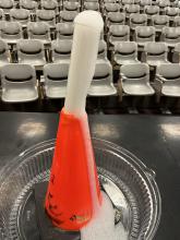 Traffic cone “volcano” with hydrochloric acid and chalk pieces in the test tube 